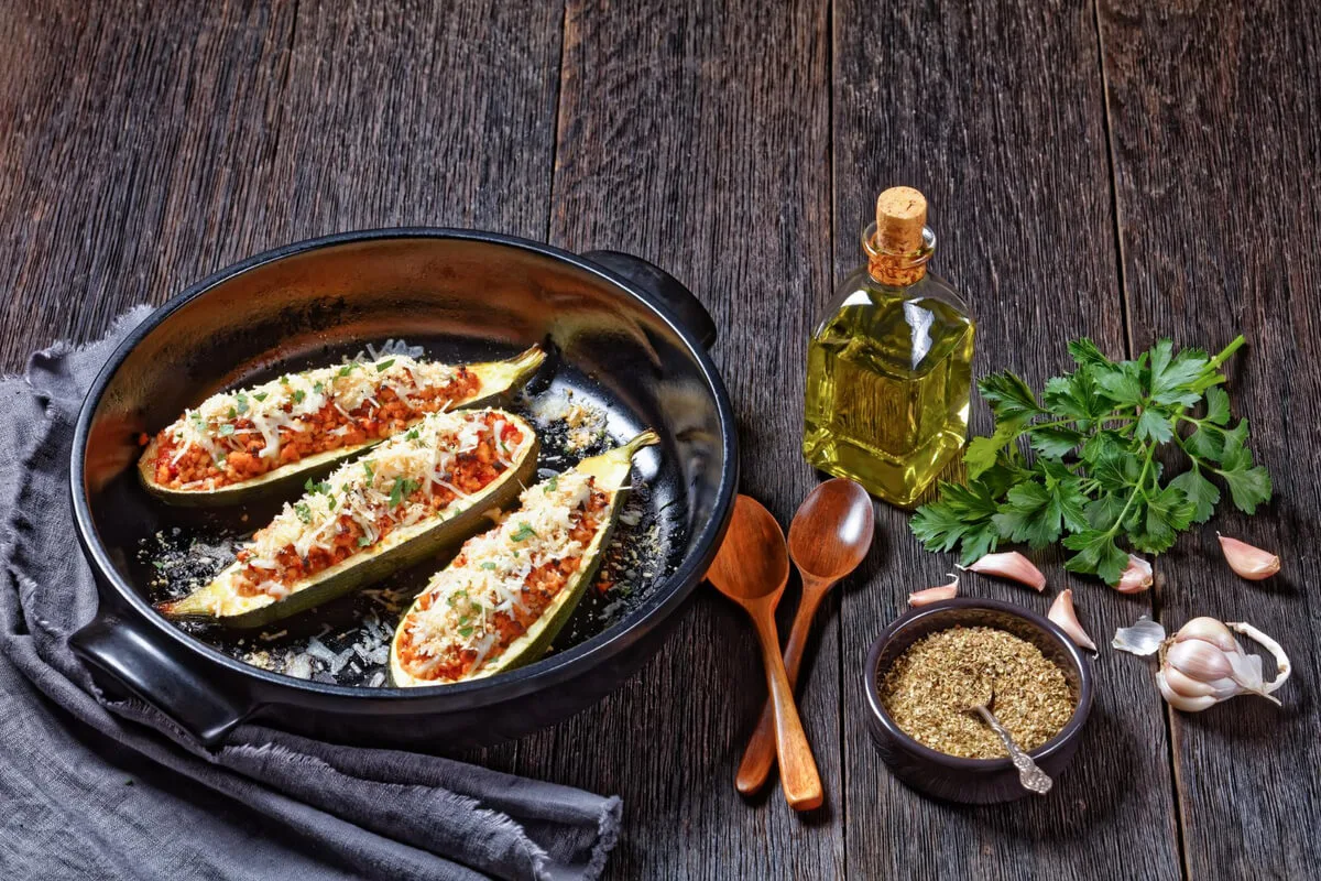 Vegan eggplant parmesan topped with marinara and fresh basil