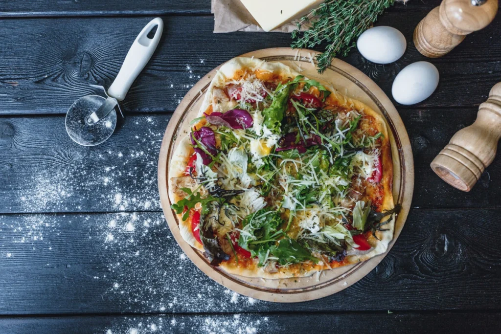 A freshly baked cauliflower crust pizza topped with vibrant vegetables.