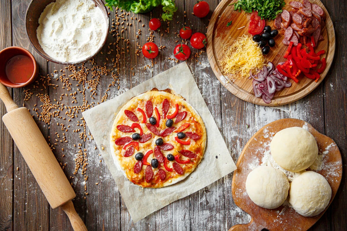 A freshly baked pizza with traditional dough, French bread, and focaccia crusts.