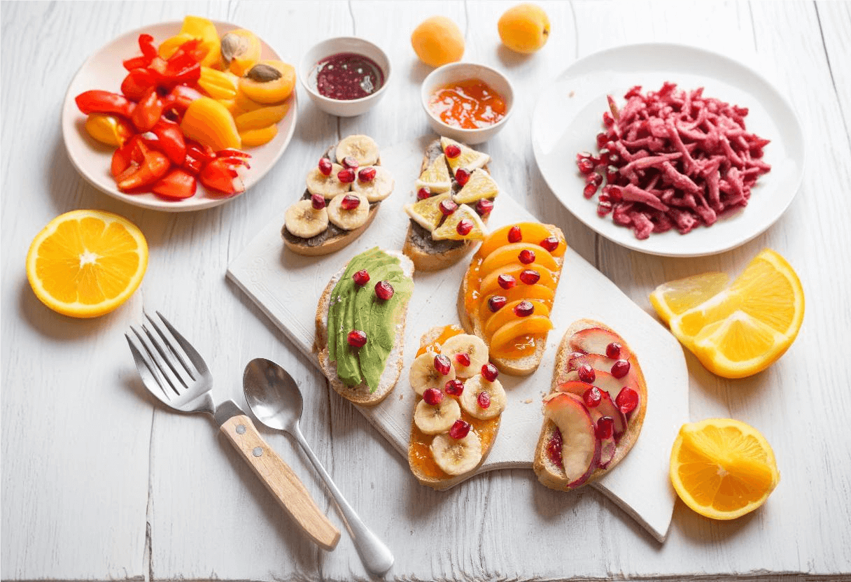 A vibrant vegan breakfast spread featuring pancakes, smoothie bowls, avocado toast, and tofu scramble, showcasing vegan breakfast recipe ideas.