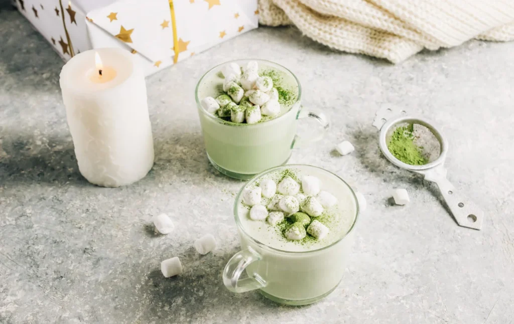 Starbucks matcha latte served hot and iced on a café table.